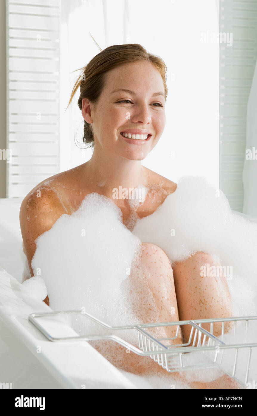 Young woman having a bubble bath Stock Photo - Alamy