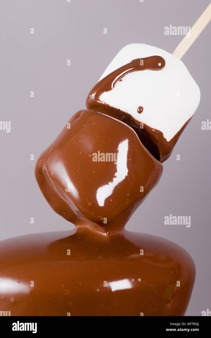 Marshmallows covered in chocolate Stock Photo Alamy