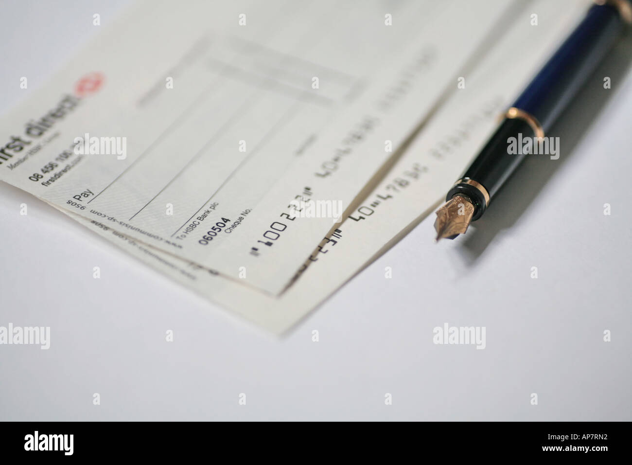 cheque book pages and pen Stock Photo Alamy