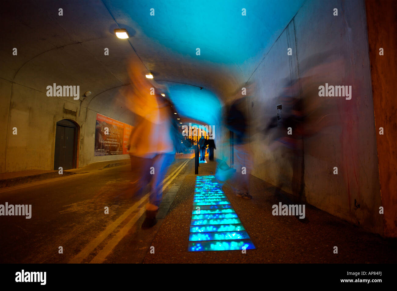 A tunnel lit with illuminated pavement on the south bank side of the river Thames, London. Stock Photo