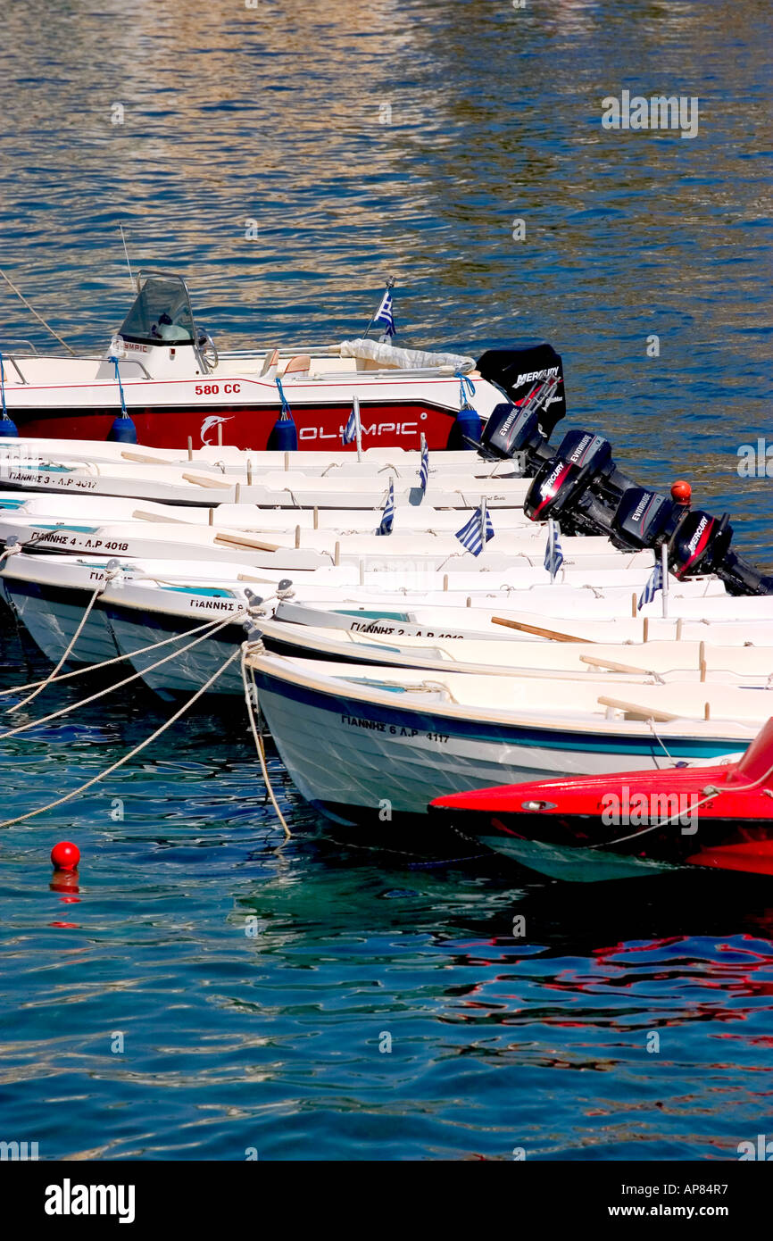 fishing rowing in symi harbour in symi islands dodecanese greece Stock Photo