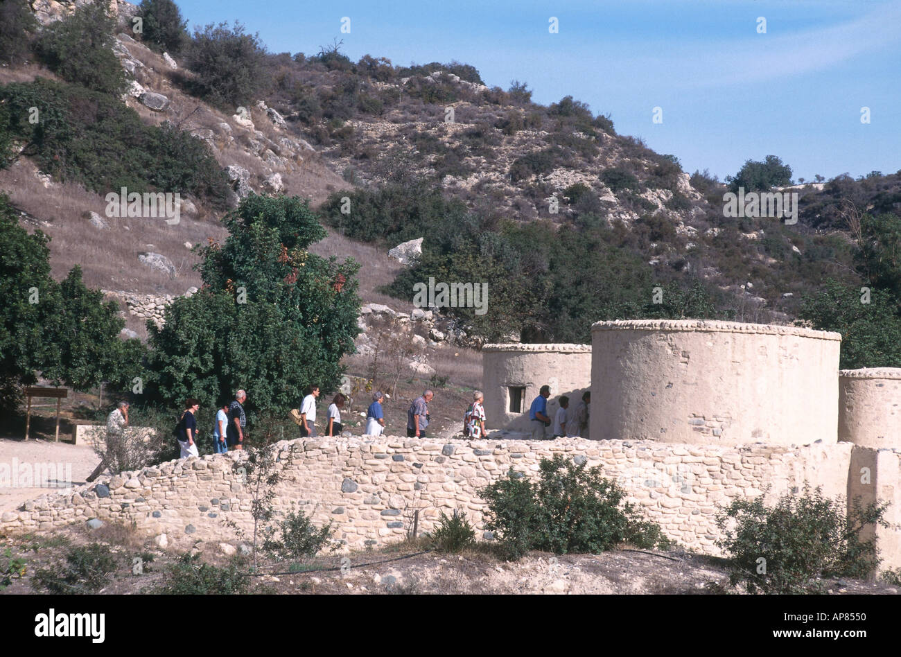 Tourists near round cottages, Khirokitia, Larnaca, Cyprus Stock Photo