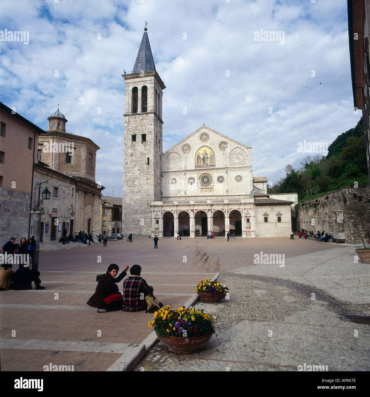 Group of people sitting in front of church, Spoleto, Umbria, Italy ...
