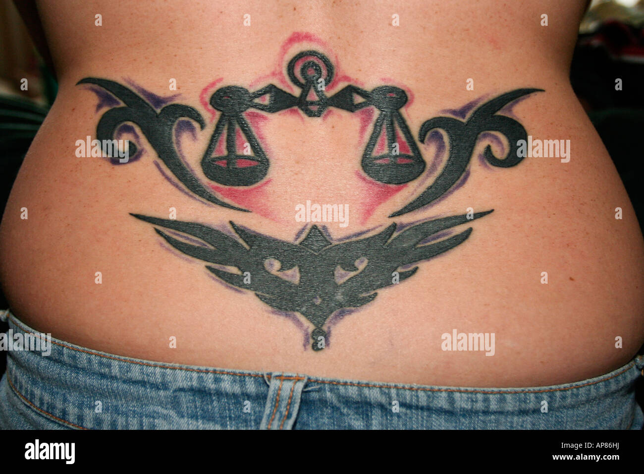 Female Lower Back Tattoo Stock Photo