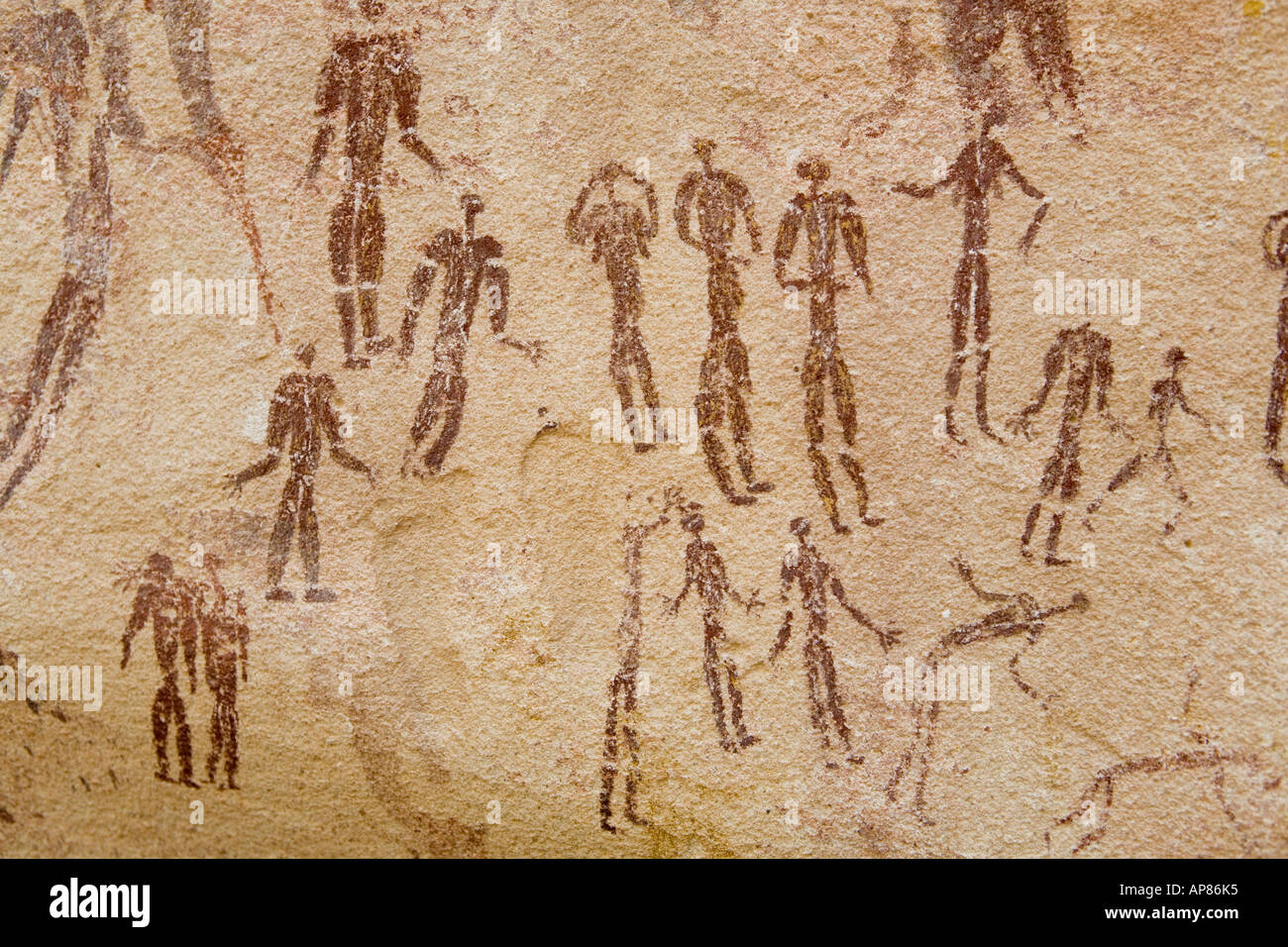 Tribal scene with many people - Rock art, Mestekawi Cave, Gilf Kebir, Egypt's Western desert. Stock Photo