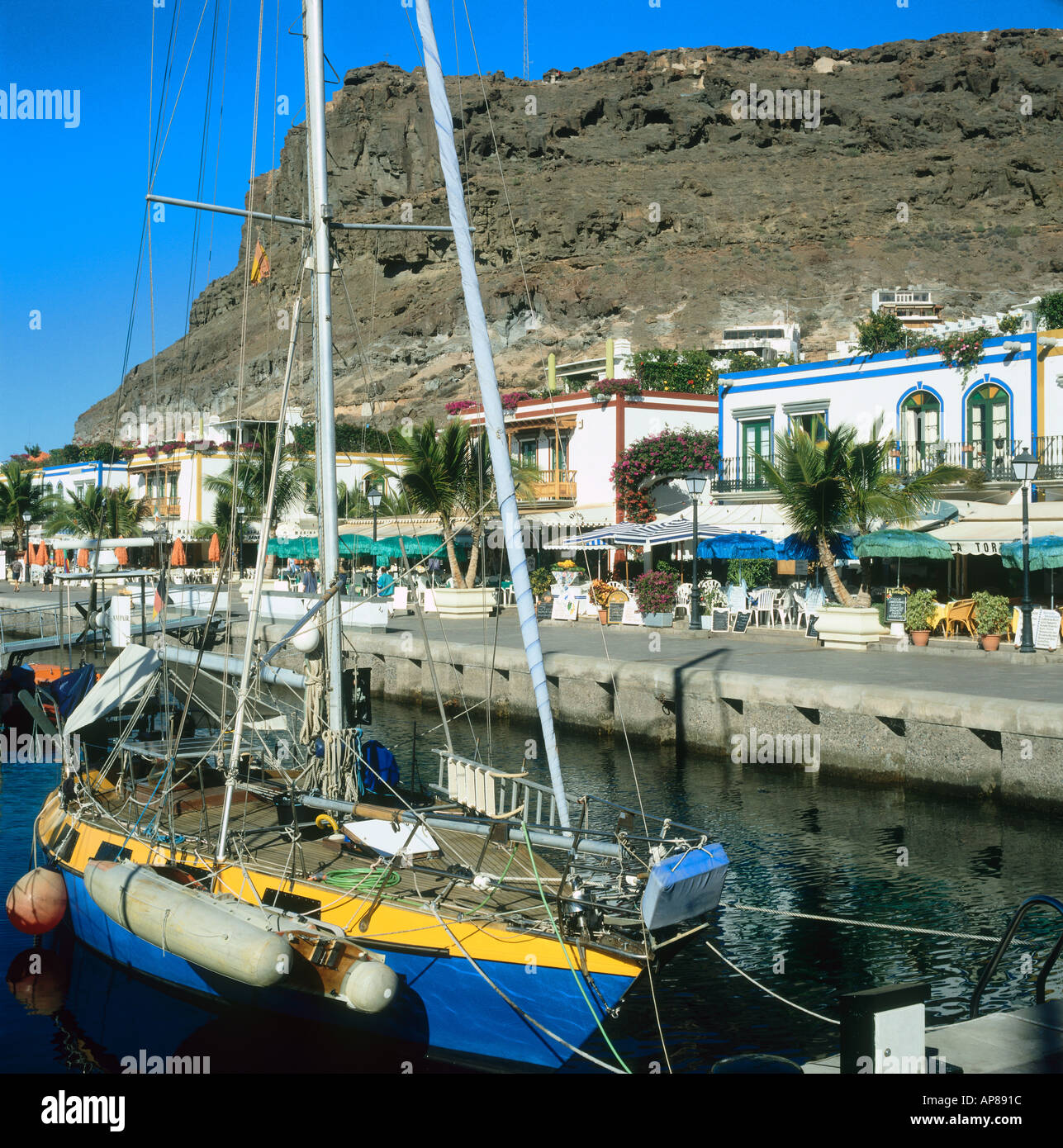 Close of a sailboat with houses in the background, Puerto de Mogan, Gran Canaria, Canary Islands, Spain Stock Photo