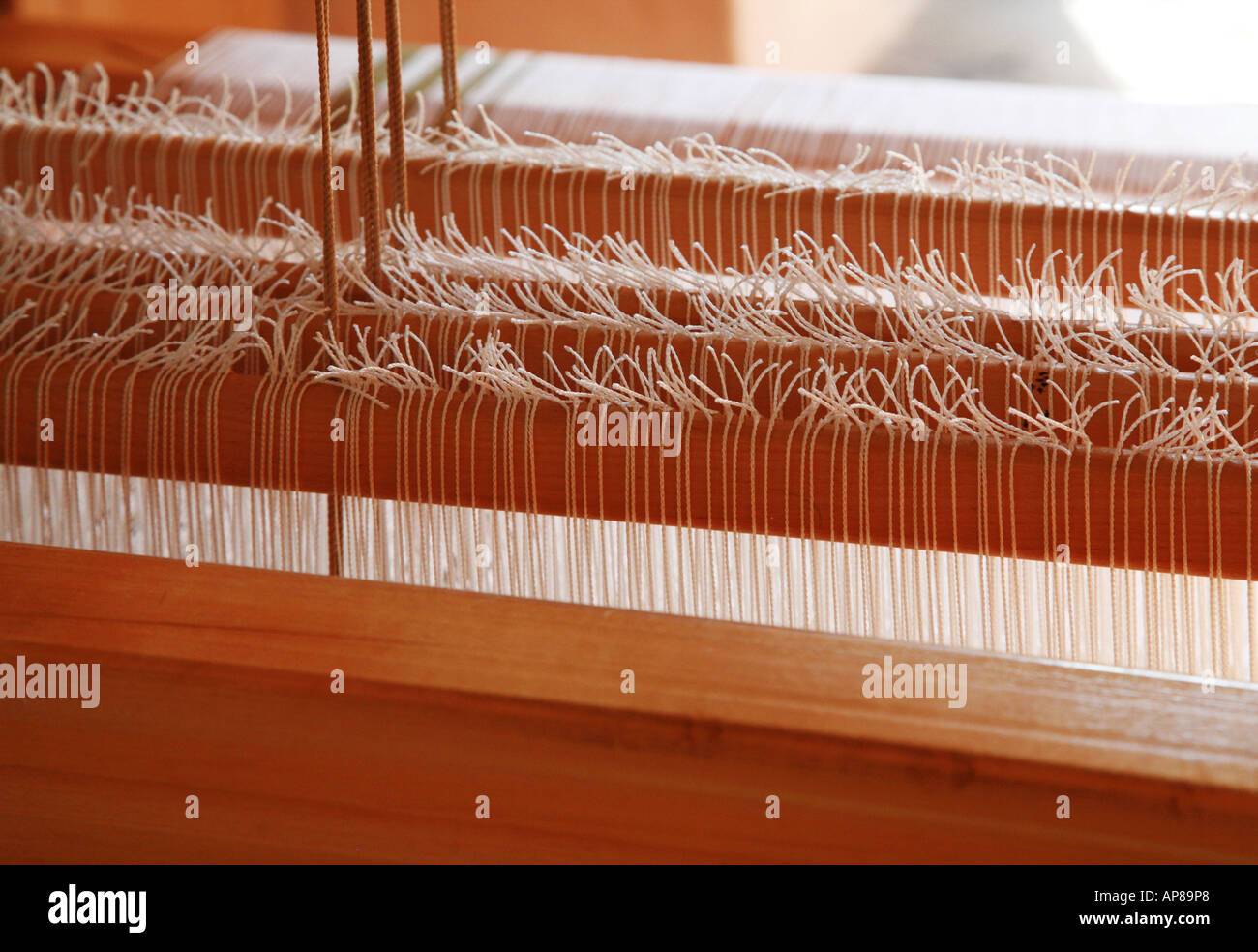 Warp knots on a weavers loom Stock Photo