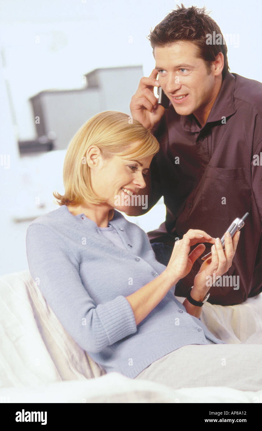 Young couple using mobile phones Stock Photo