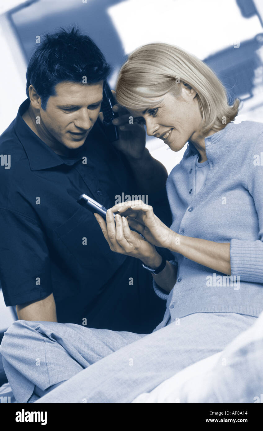 Young couple using mobile phones Stock Photo