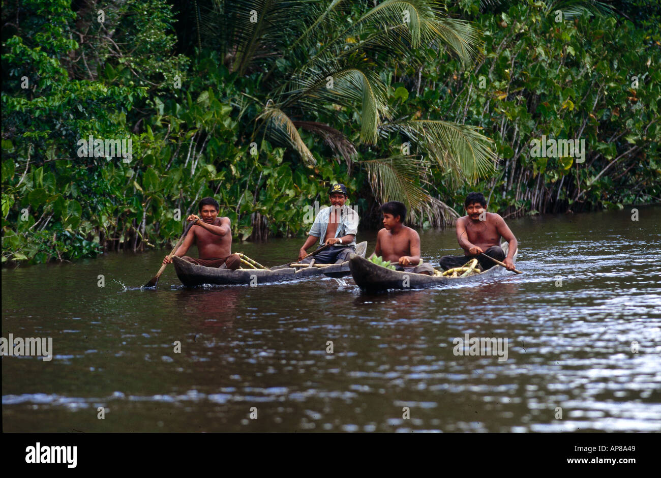 Warao indians boating in river, Venezuela Stock Photo