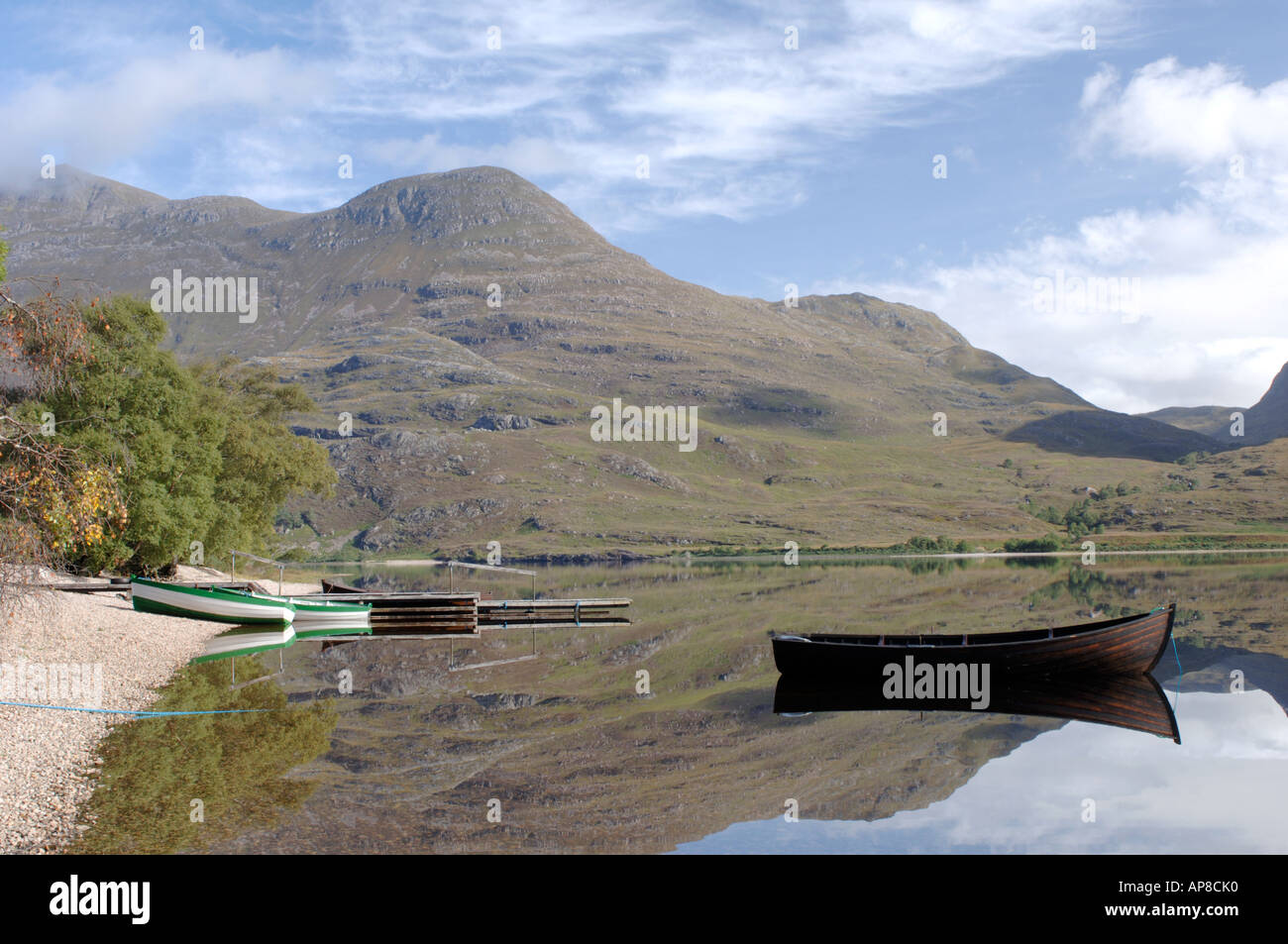 Fishing boats at their moorings on Calm Loch Marree, Kinlochewe. Wester Ross. XPL 3486-340 Stock Photo