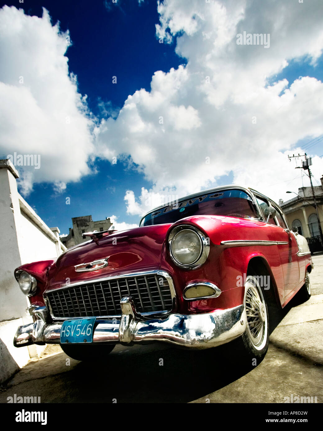 Old American Chevy (Chevrolet) sits parked at a garage in Havana (Cuba). Classic American cars are seen throughout Cuba. Stock Photo