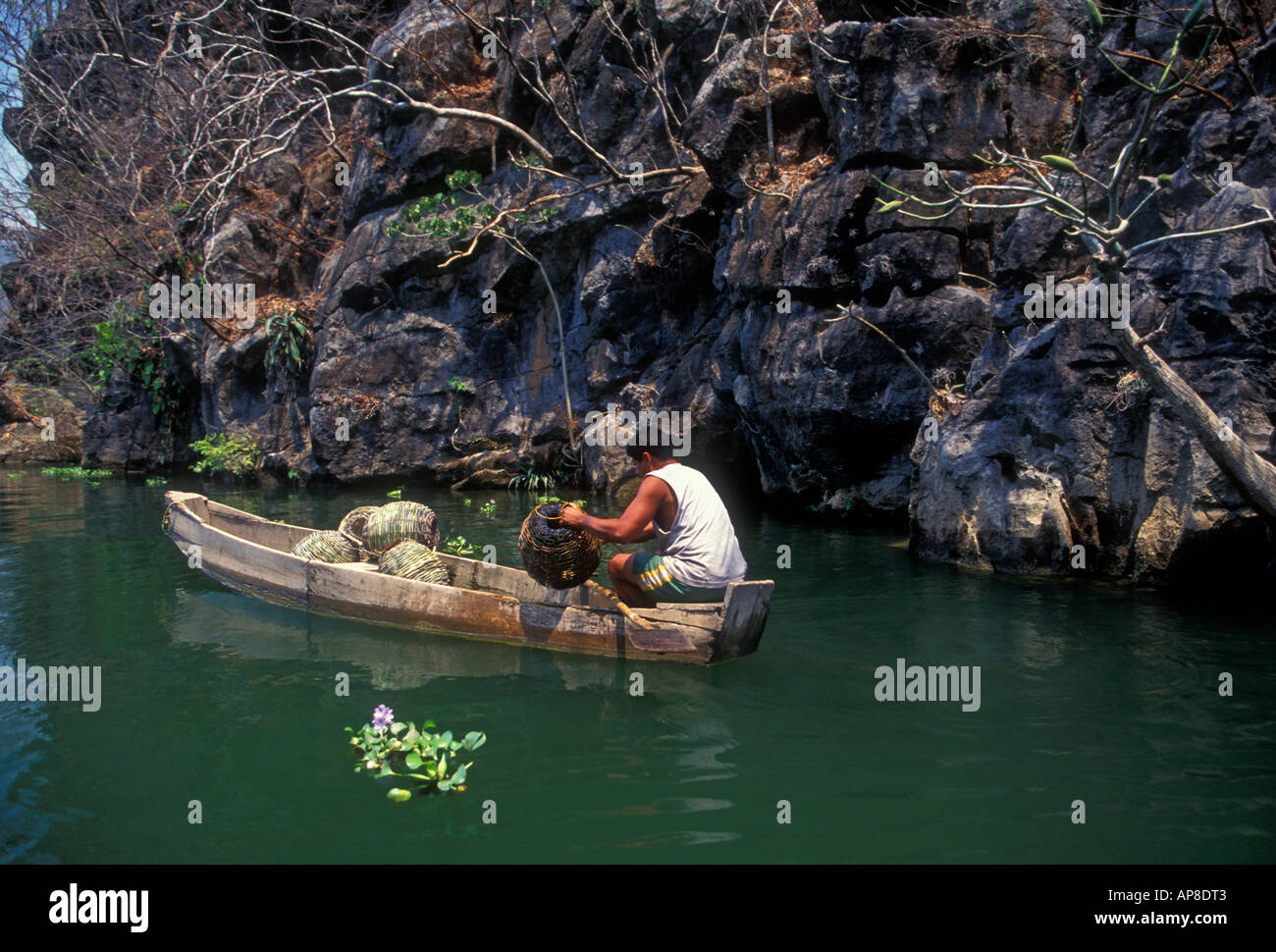 1, one, Mexican man, fisherman, fishing with fish trap, fishing, canoe