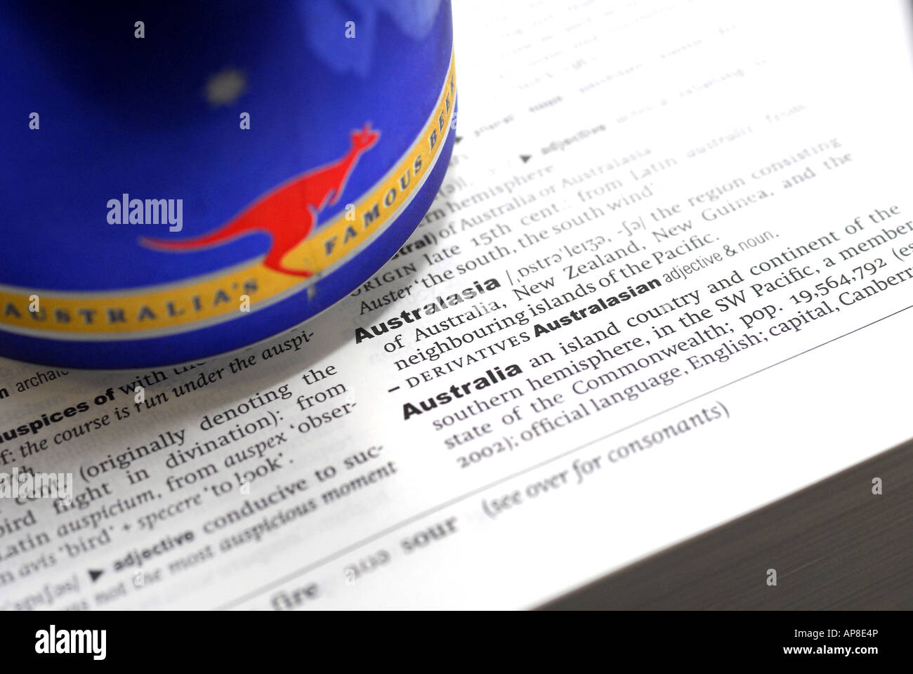 The Oxford English Dictionary showing the meaning of the world Australia with a Fosters Beer can