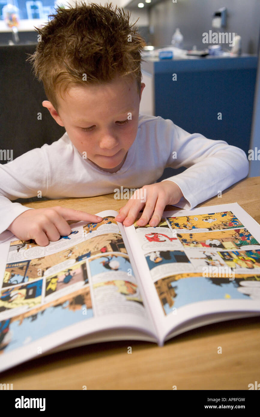 boy-is-reading-a-comic-stock-photo-alamy