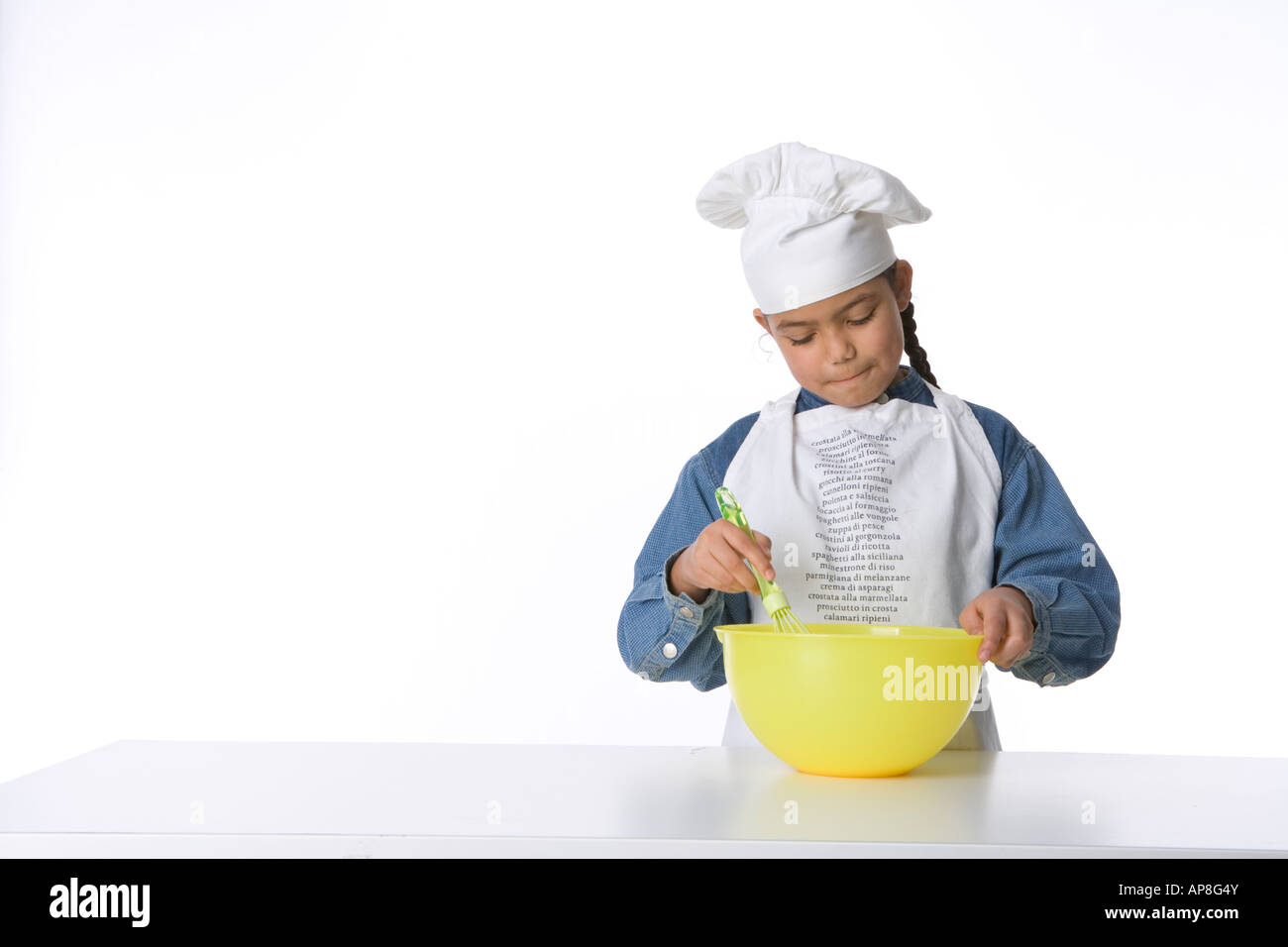 Girl is making batter for cakes Stock Photo - Alamy