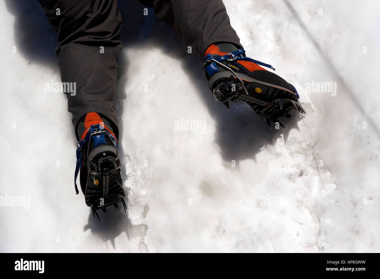 Climber climbing a wall of ice and snow Stock Photo