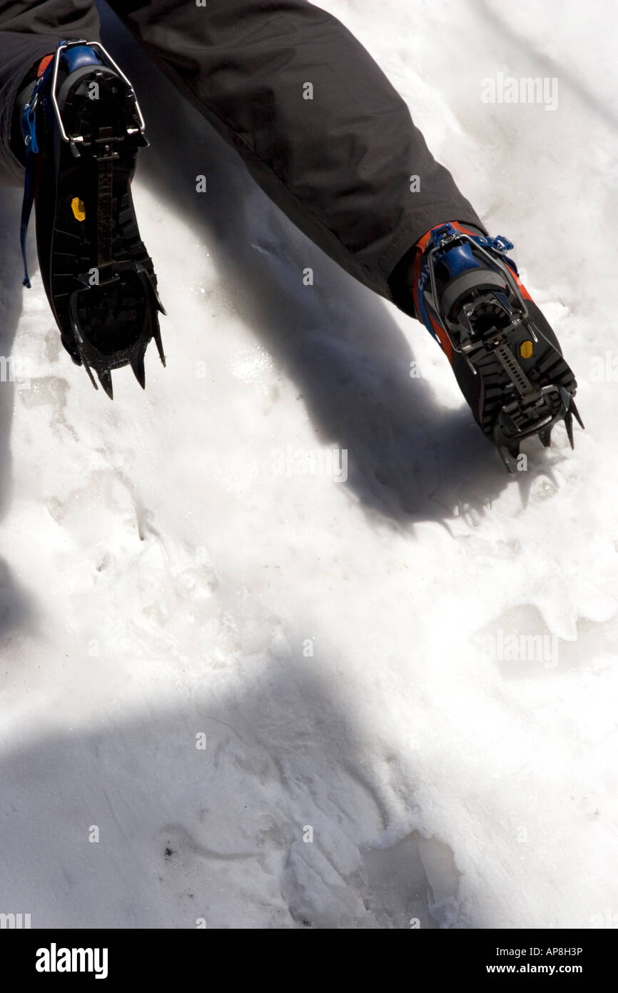 Climber climbing a wall of ice and snow Stock Photo