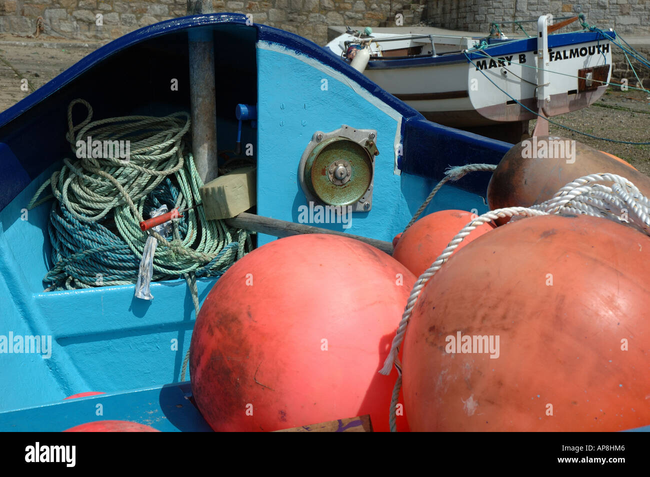 England, Cornwall, Mousehole, buoys on fishing boat moored in harbour Stock Photo