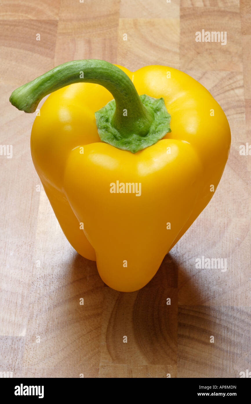 Yellow Pepper on Chopping Board Stock Photo - Alamy