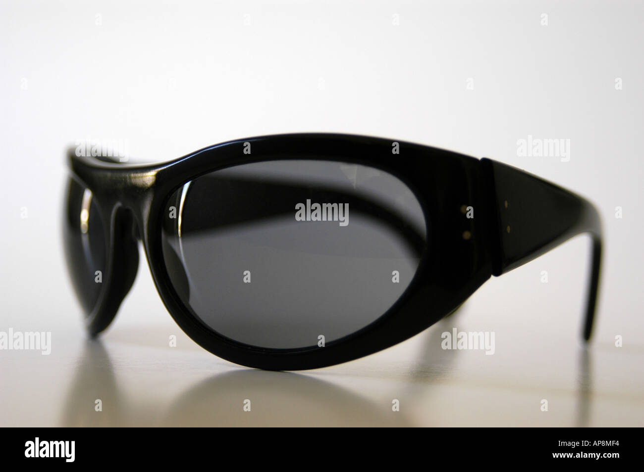 Black wrap around sunglasses Stock Photo