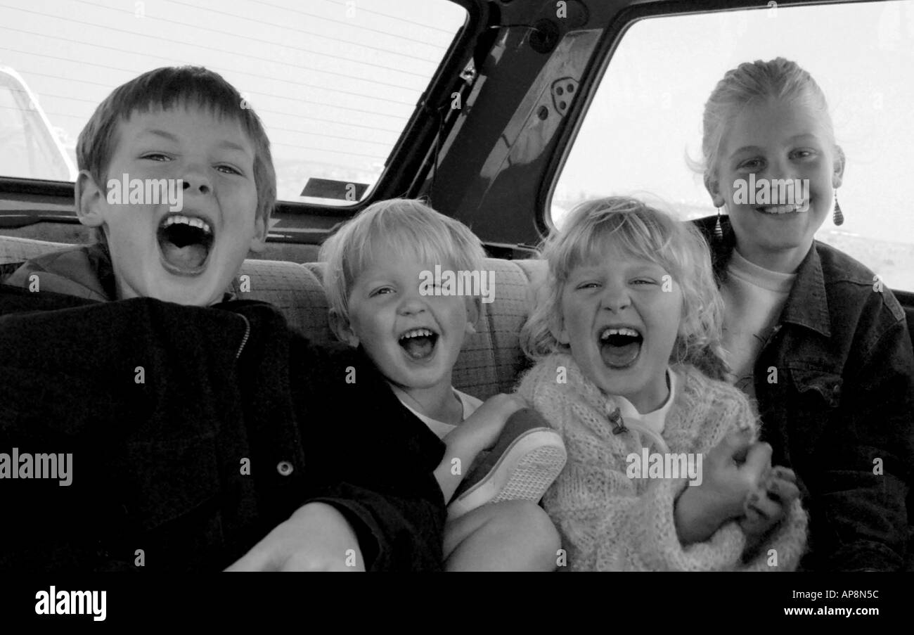 Screaming kids in back of car Alicante Spain Stock Photo