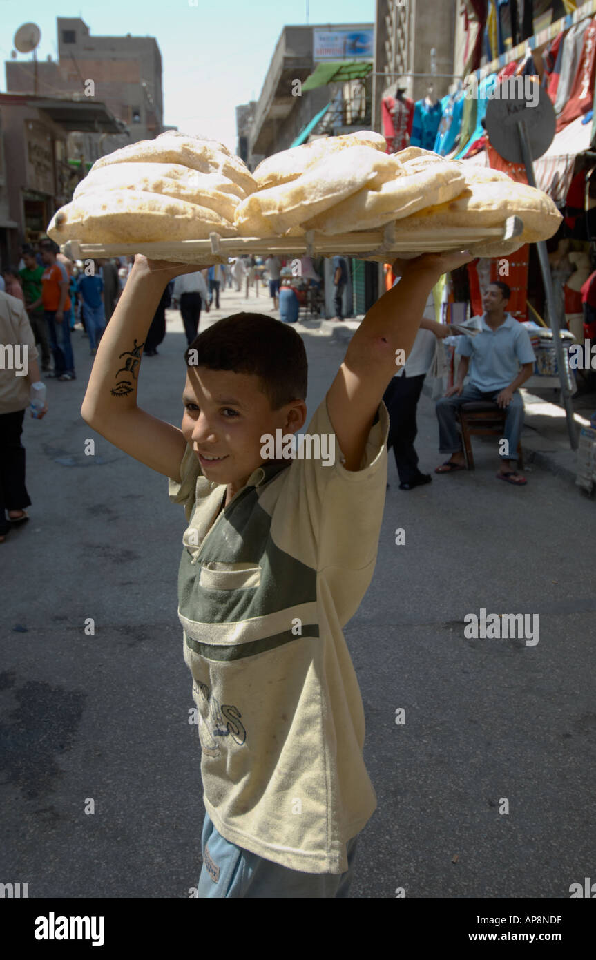 Boy selling bread, Cairo souk, Egypt Stock Photo
