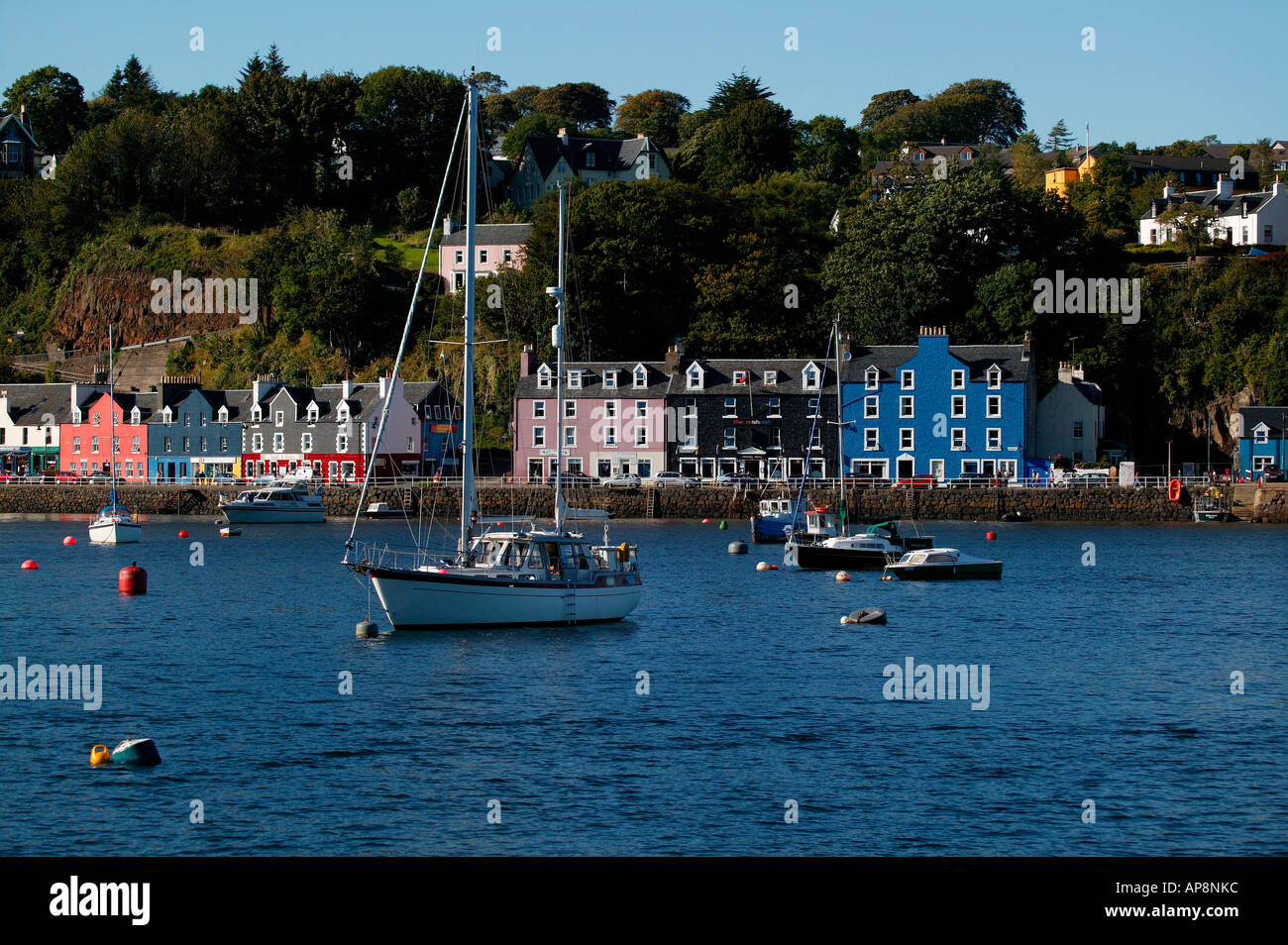 Brightly coloured houses of Tobermory, with boats in foreground, Isle of Mull, Sound of Mull, Scotland Stock Photo