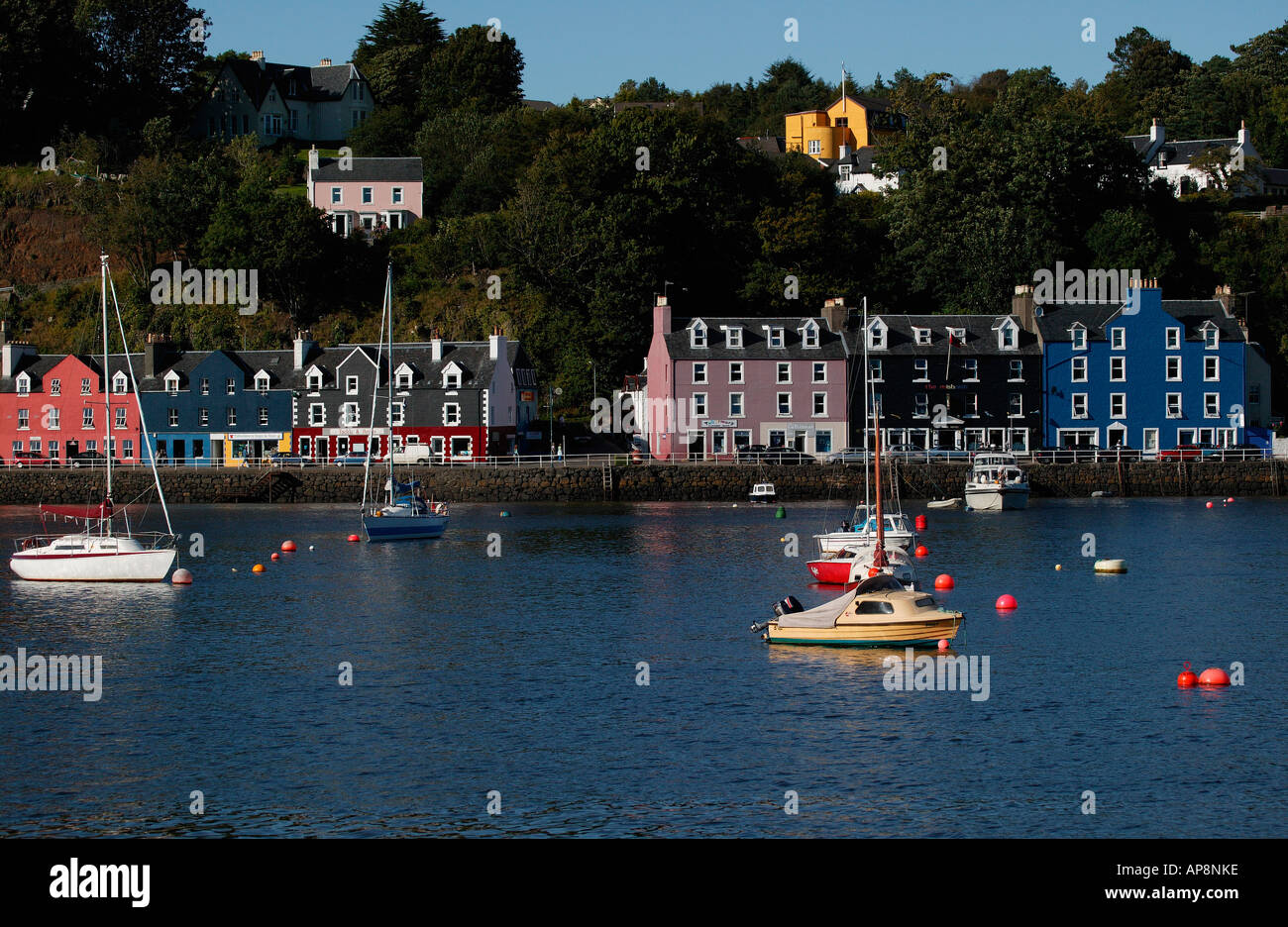 Brightly coloured houses of Tobermory, with boats in foreground, Isle of Mull, Sound of Mull, Scotland Stock Photo