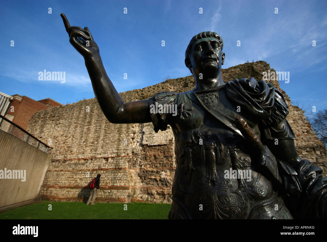 Statue of the Roman Emperor Trajan AD 98-117 outside the last remaining section of the Roman wall at Tower Hill, London. Stock Photo