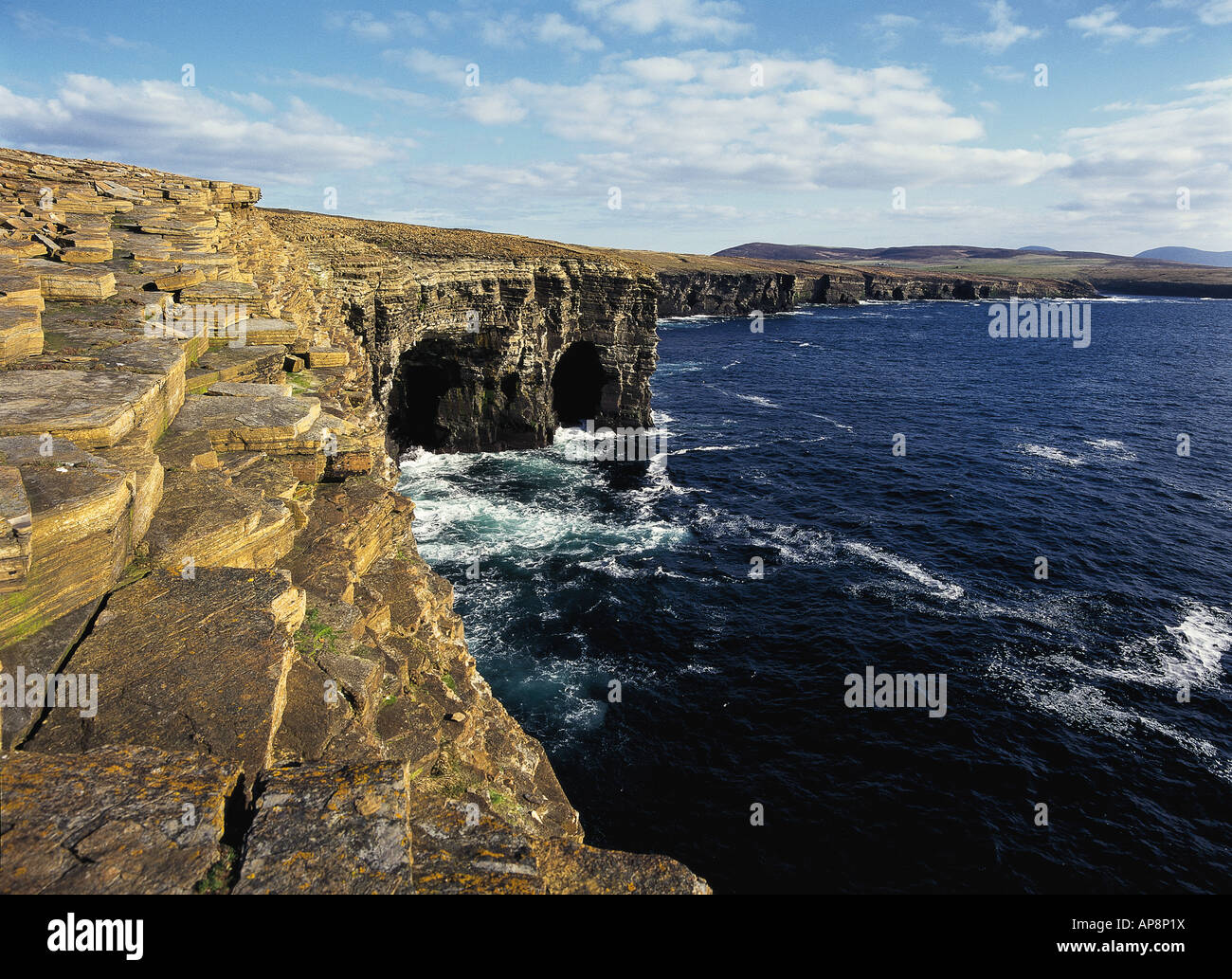 dh South of Bay of Skaill SANDWICK ORKNEY Sea caves cliffs and west coast basalt cave Stock Photo