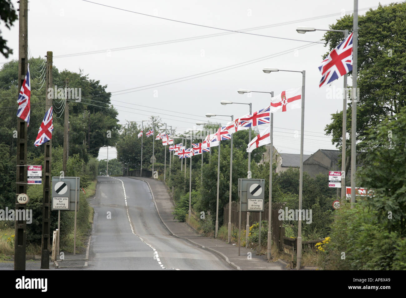 union and ulster flags line the mallusk road newtownabbey during Julys