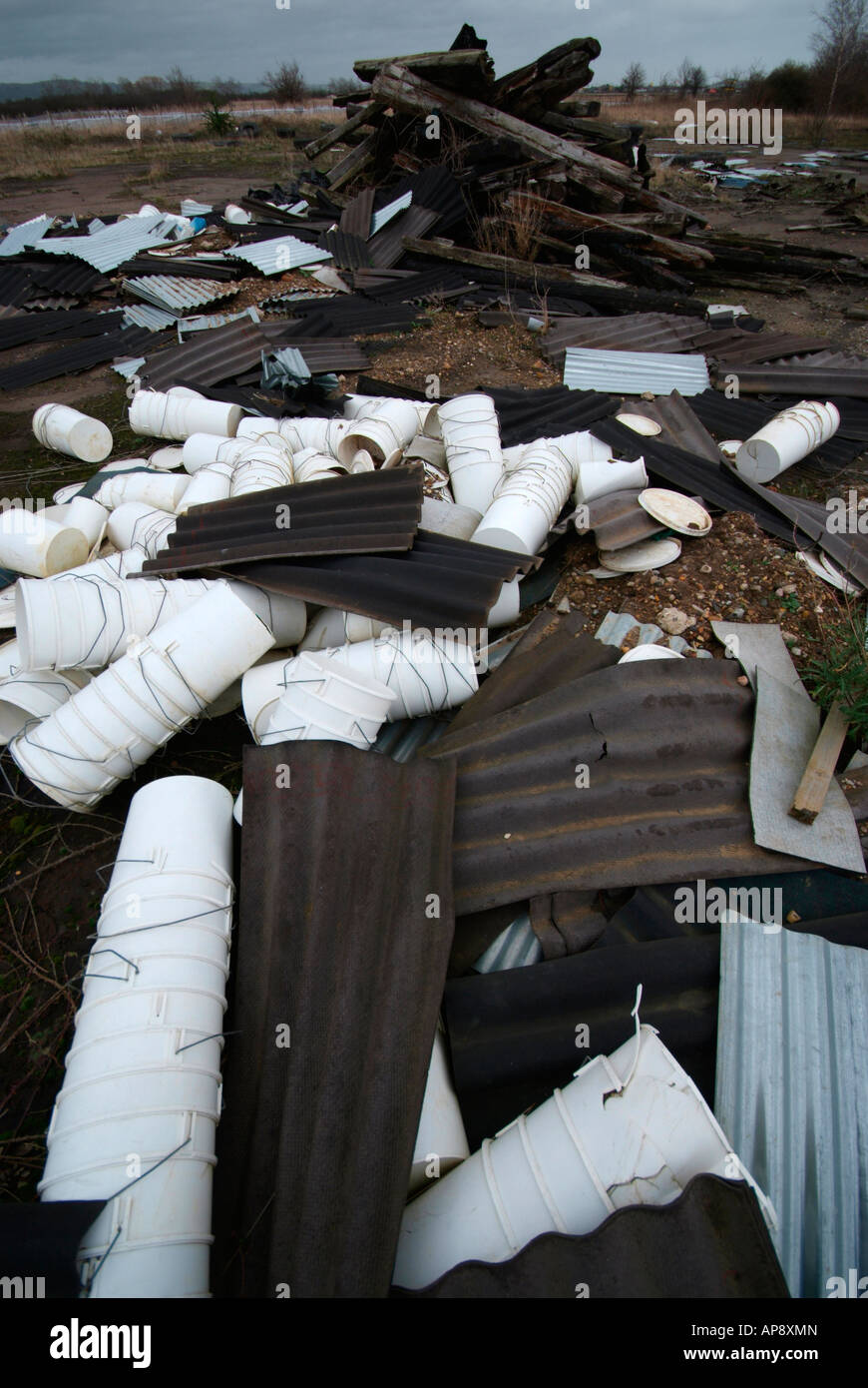 Rubbish dumped on the ground litters the landscape. Stock Photo