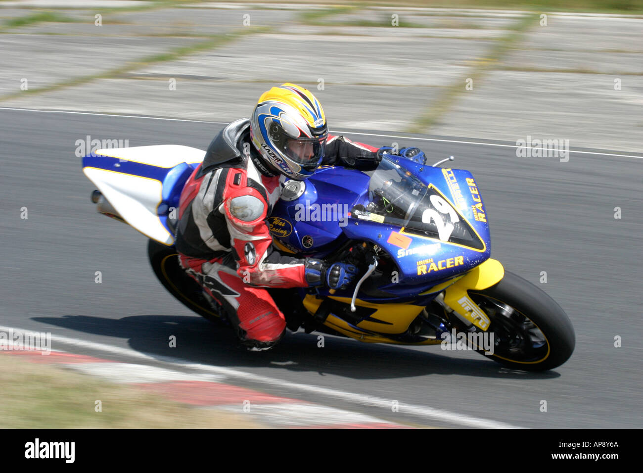 Yellow And Blue Rides Rider on blue yellow race bike 29 during trackday at Kirkistown circuit ...