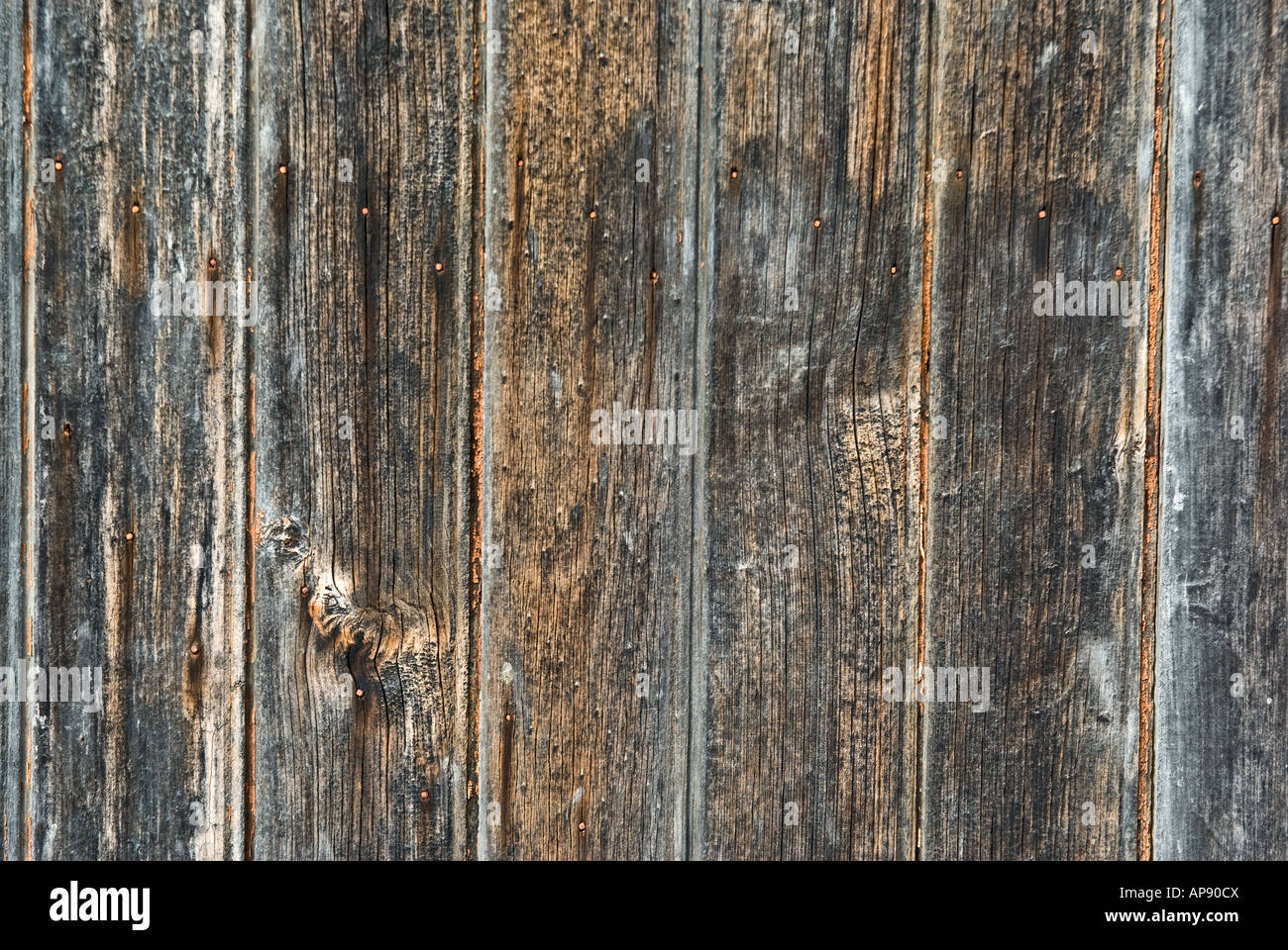 dark dirty and grungy fence panels make a wooden background Stock Photo
