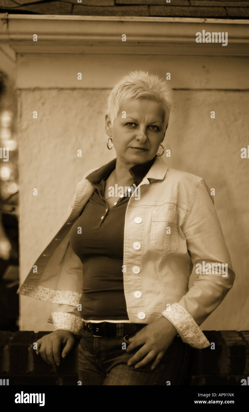 Woman alone portrait happy jeans hi-res stock photography and images ...