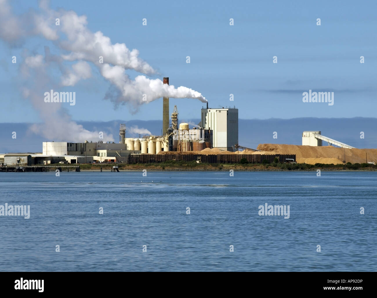 Stock image of a wood processing facility on the edge of Humbolt Bay near Eureka California in landscape format Stock Photo