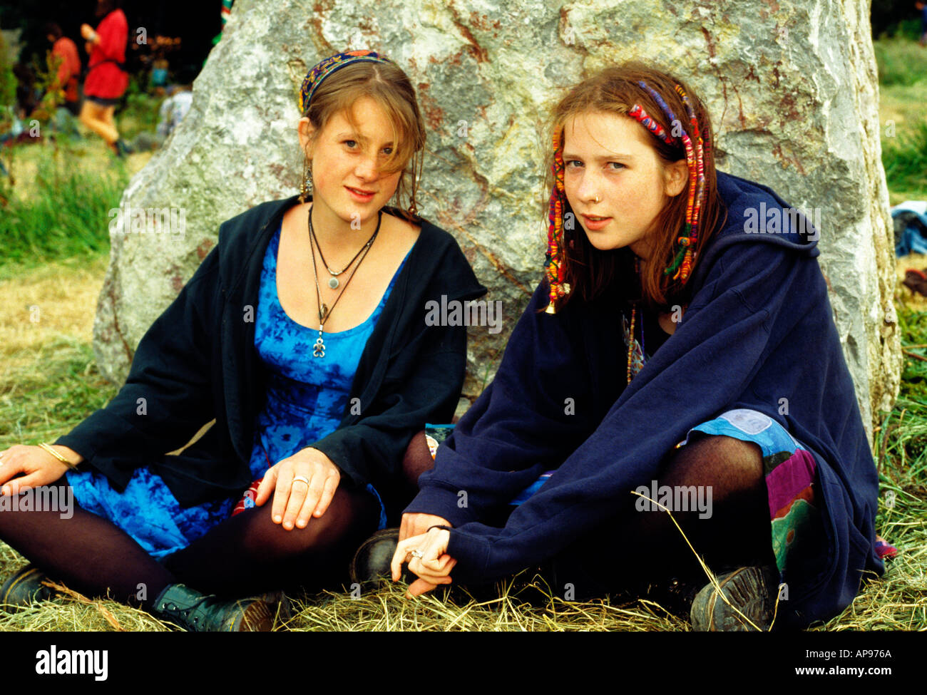 Girls at stone circle Glastonbury Stock Photo