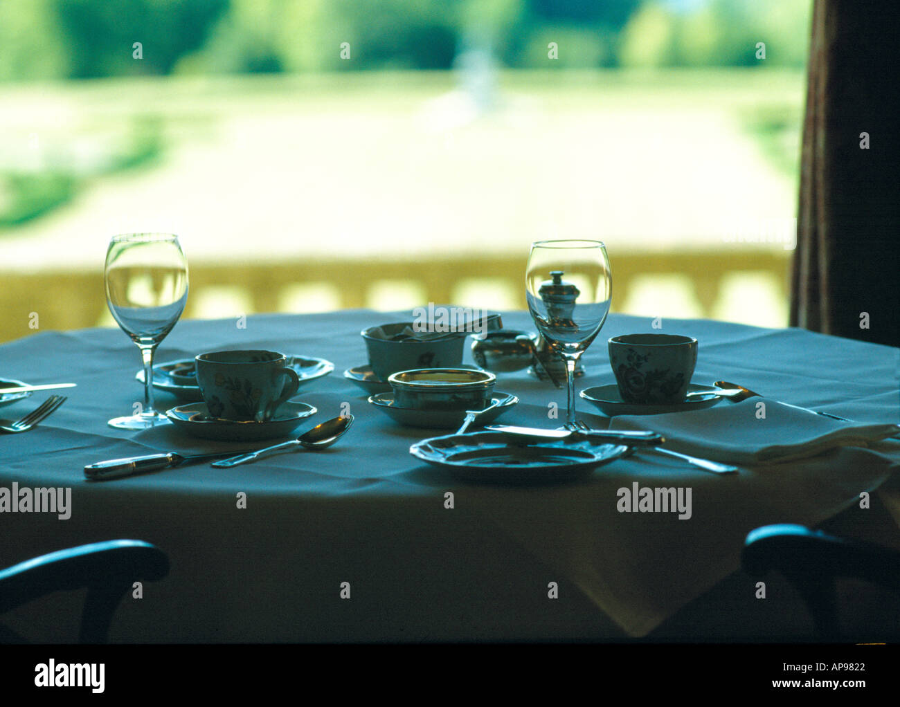 A set table by the window Stock Photo Alamy