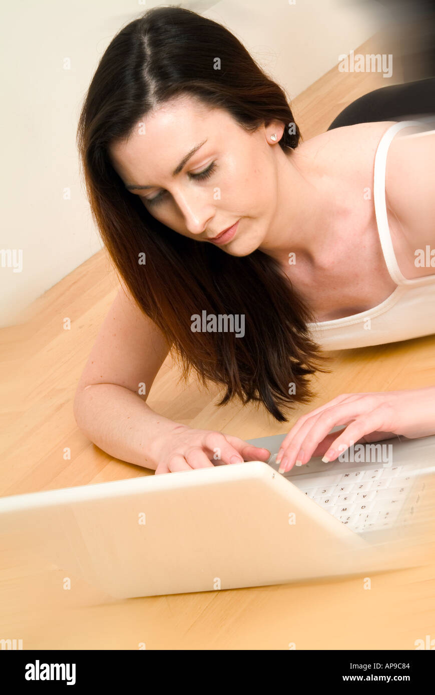 A young woman using a laptop computer  Stock Photo