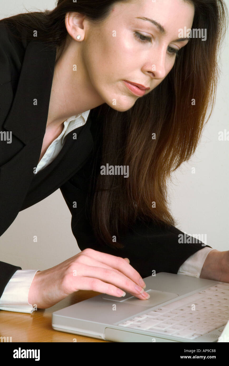 A young woman using a laptop computer  Stock Photo