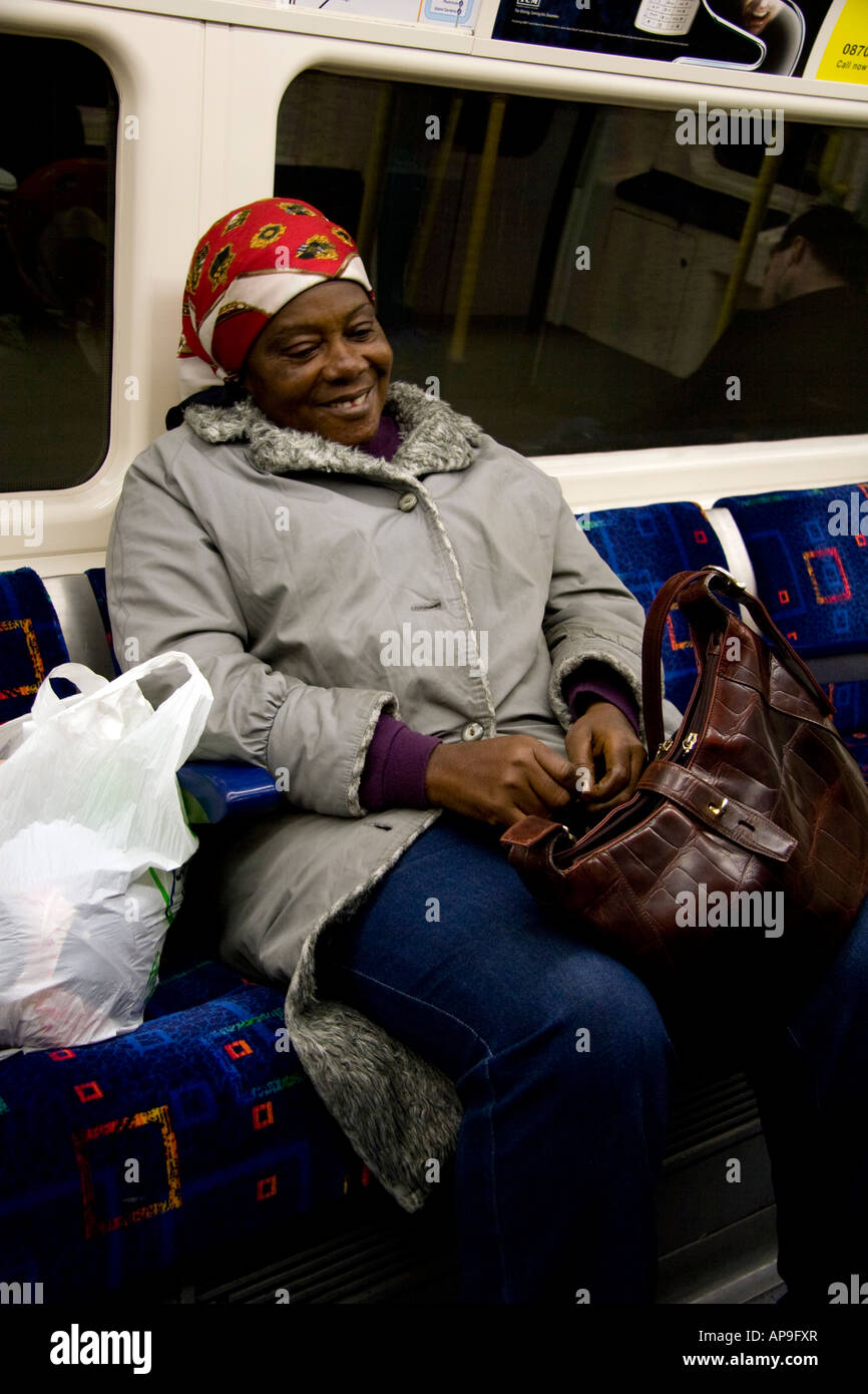 woman on the underground smiling Stock Photo