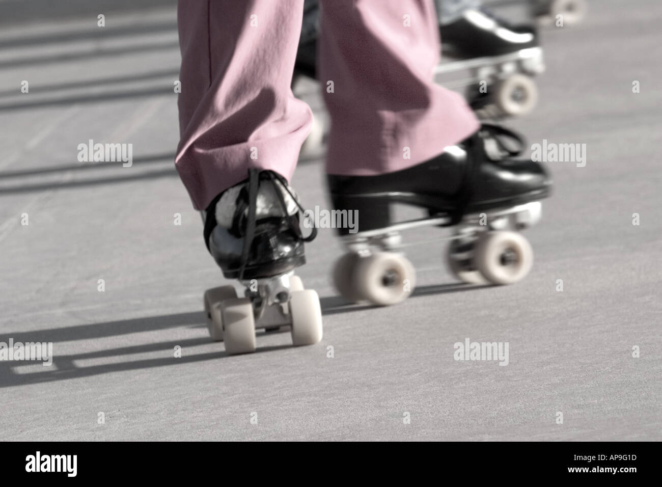 Closeup image of people's legs and feet roller skating Stock Photo Alamy