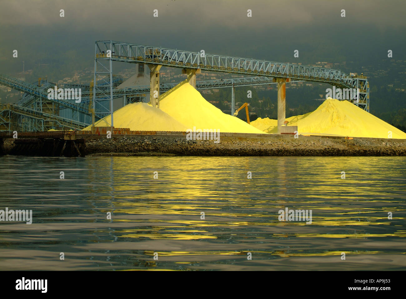 Sulphur piles on dock waiting export by ship Stock Photo Alamy