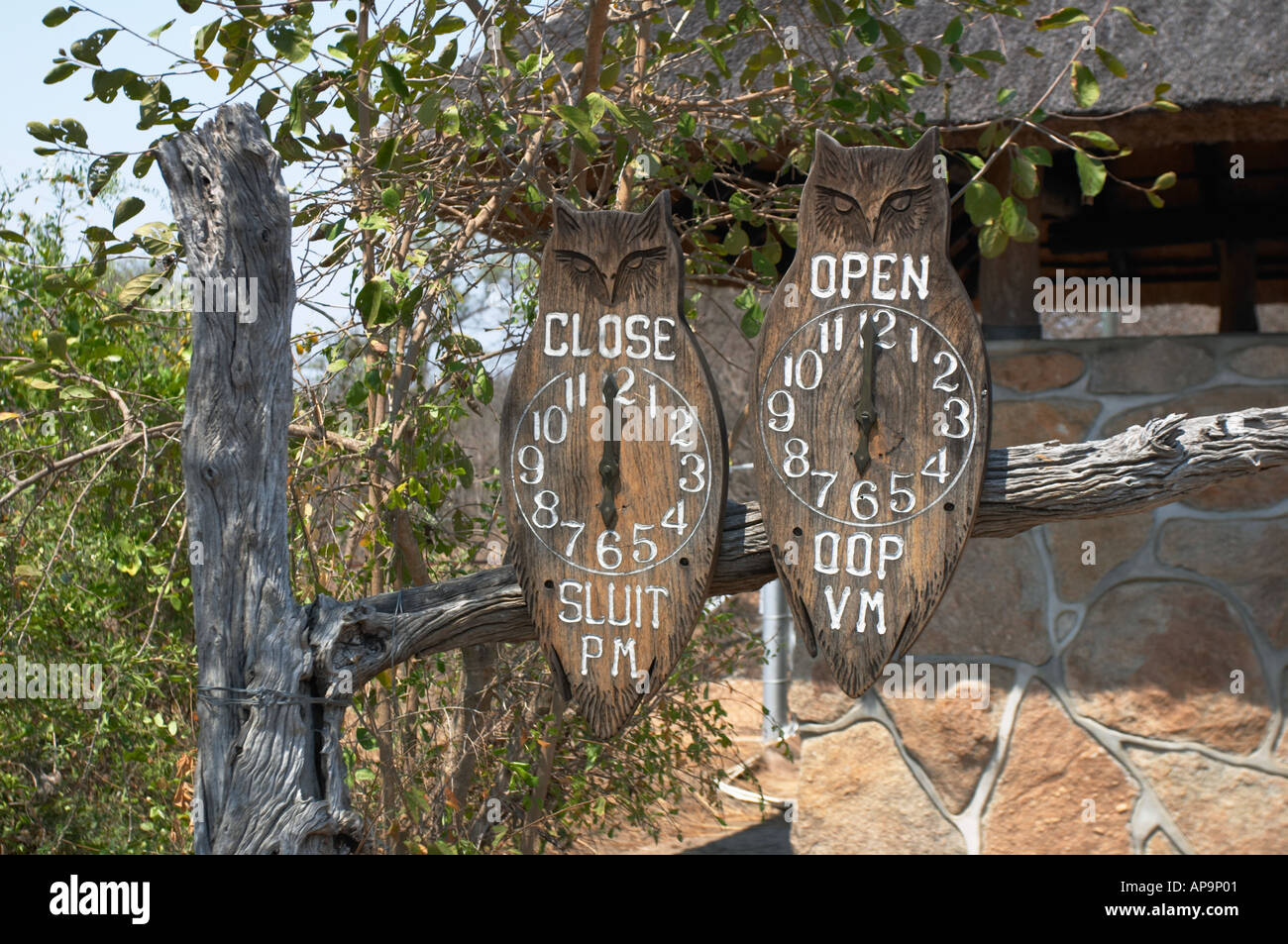 Owls showing park opening and closing times at exit at Skukuza and all