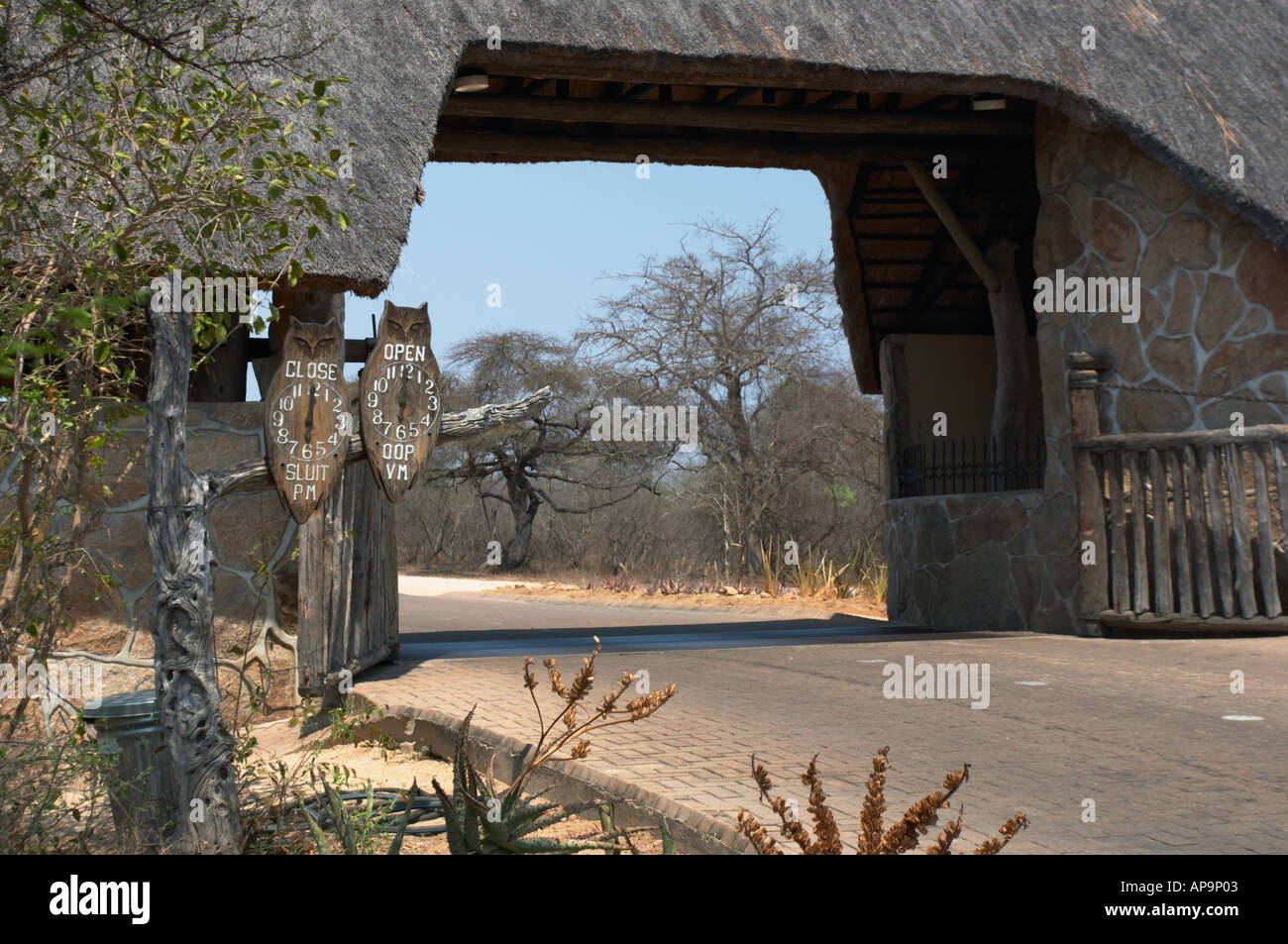 Camp gate at Skukuza with Owls showing park opening and closing times