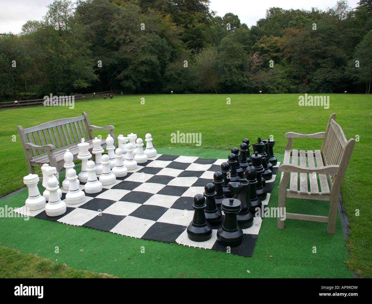 Giant chess set in garden Stock Photo