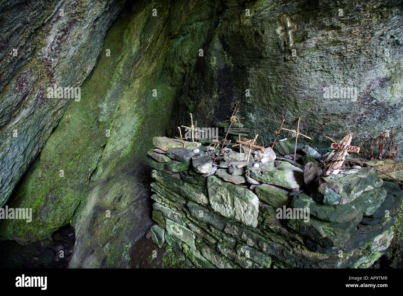 Wooden crosses on altar within St Columba's cave chapel near Ellary, Argyll & Bute, Scotland Stock Photo