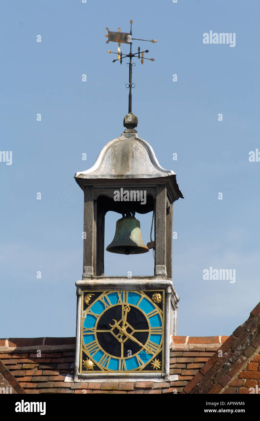 Bell Tower with Clock and Weather Vane on a rooftop, England, UK Stock