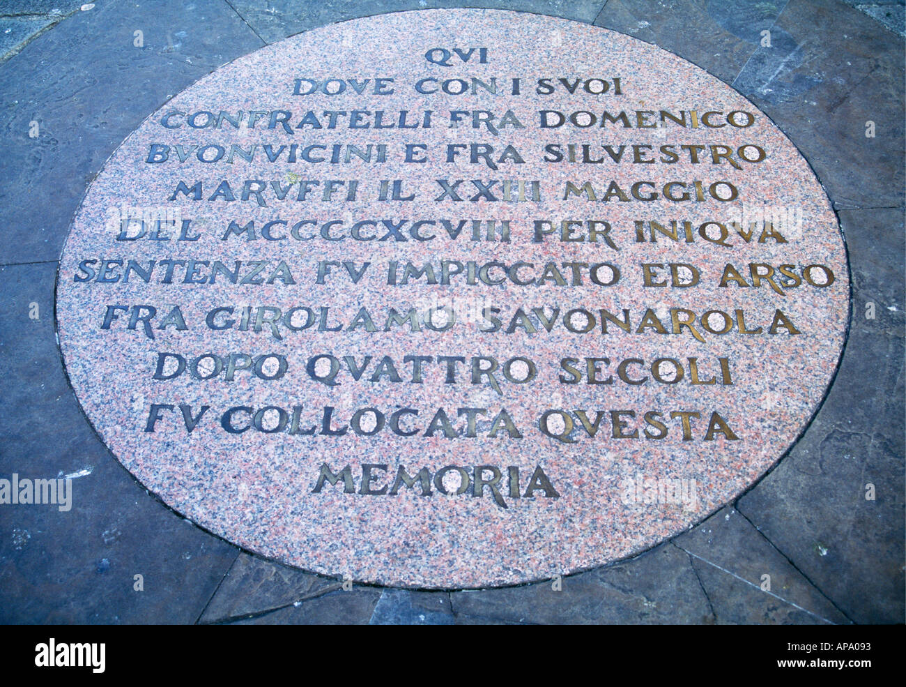 The inscription on a round stone set in the pavement in Florence s famous Piazza della Signoria which marks the spot of the execution of the monk Girolamo Savonarola and his two Dominican disciples on 23 May 1498 Italy Stock Photo